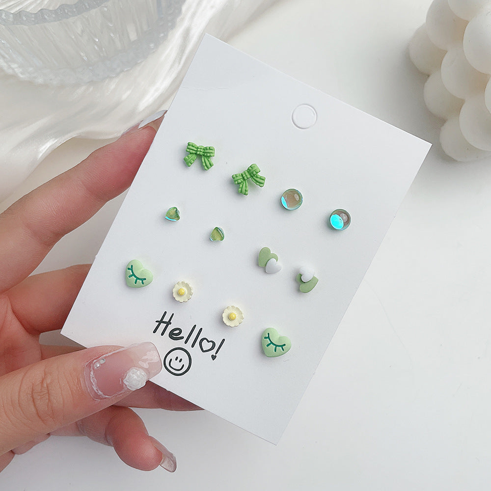 Venta al por mayor Conjunto de pendientes de aleación con forma de corazón y mariposa